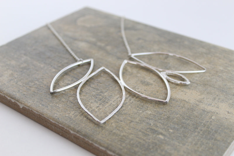 Handmade silver leaf inspired statement necklace.